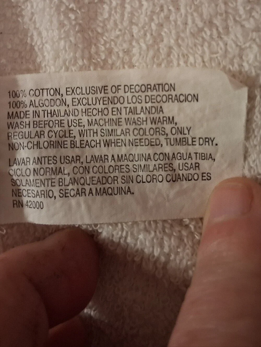 White Bath Towel With A Snowman Design On It